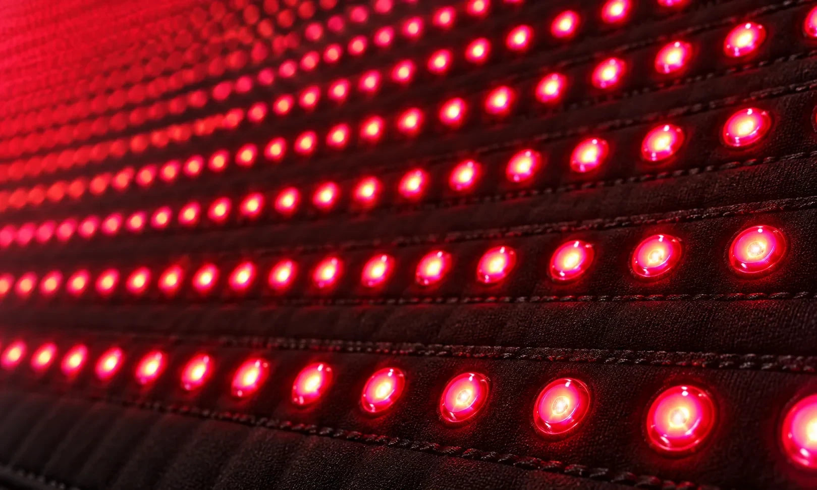 Close-up of rows of illuminated red LEDs
